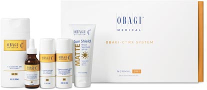 Picture of a product box and bottles, white trimmed with gold. They are advertising Obagi C RX System skin care creams