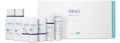 Product box with white bottles with light blue trim containing Obagi Nu Derm System prescription skin creams.